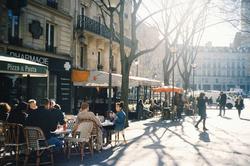 paris streets with people sitting outside