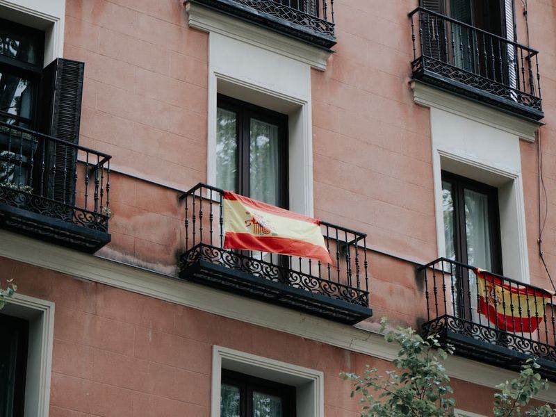 Apartment with spanish flag hanging from balcony