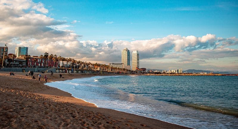 Beach with buildings behind in barcelona