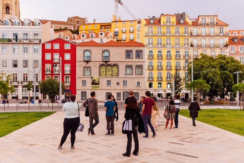 group of tourists looking at houses in lisbon